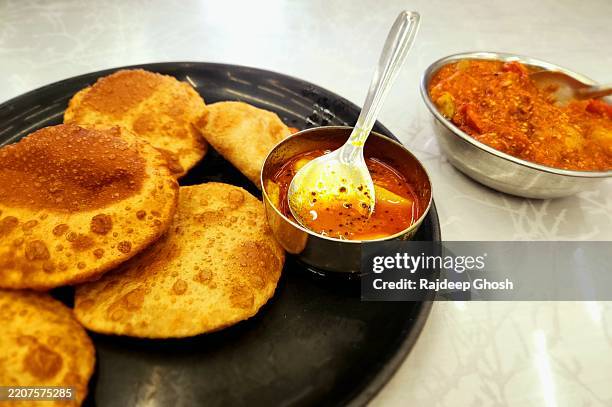 indian breakfast with puri sabji - paratha stock pictures, royalty-free photos & images