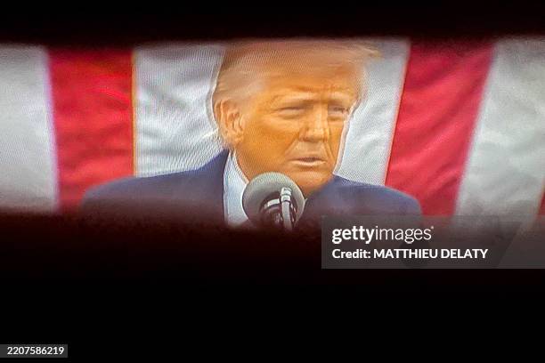 Portrait of Donald TRUMP on a television screen during the live speech broadcast on the LCI television channel by US President Donald TRUMP live from...