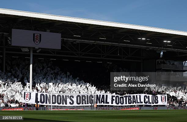 Fulham fans display a banner during the Emirates FA Cup Quarter Final match between Fulham and Crystal Palace at Craven Cottage on March 29, 2025 in...