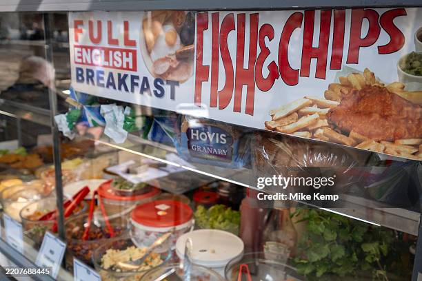 Sign for fish and chips outside a cafe in the West End on 24th March 2025 in London, United Kingdom.