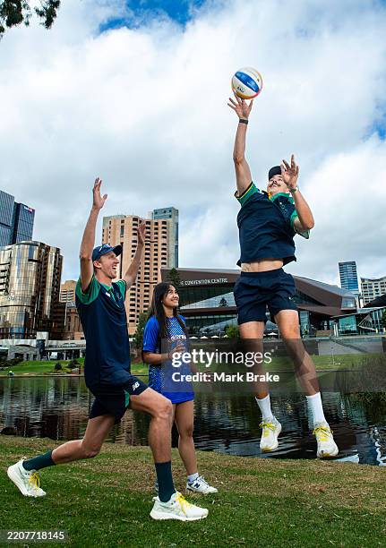 Zachary Schubert Paris Olympian and Thomas Hodges Paris Olympian with young volleyballer Sarina Sonn during a Beach Volleyball World Championships...