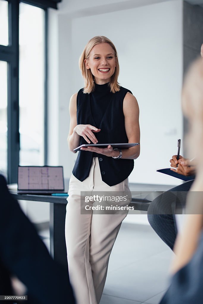Professional Woman Leading a Productive Business Meeting in a Modern Office Setting
