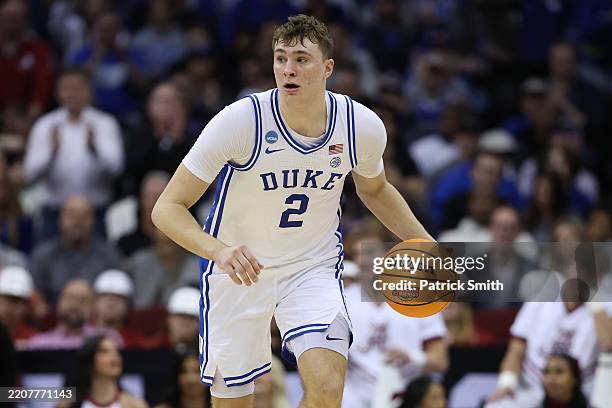 Cooper Flagg of the Duke Blue Devils handles the ball against the Alabama Crimson Tide during the second half in the East Regional Elite Eight round...