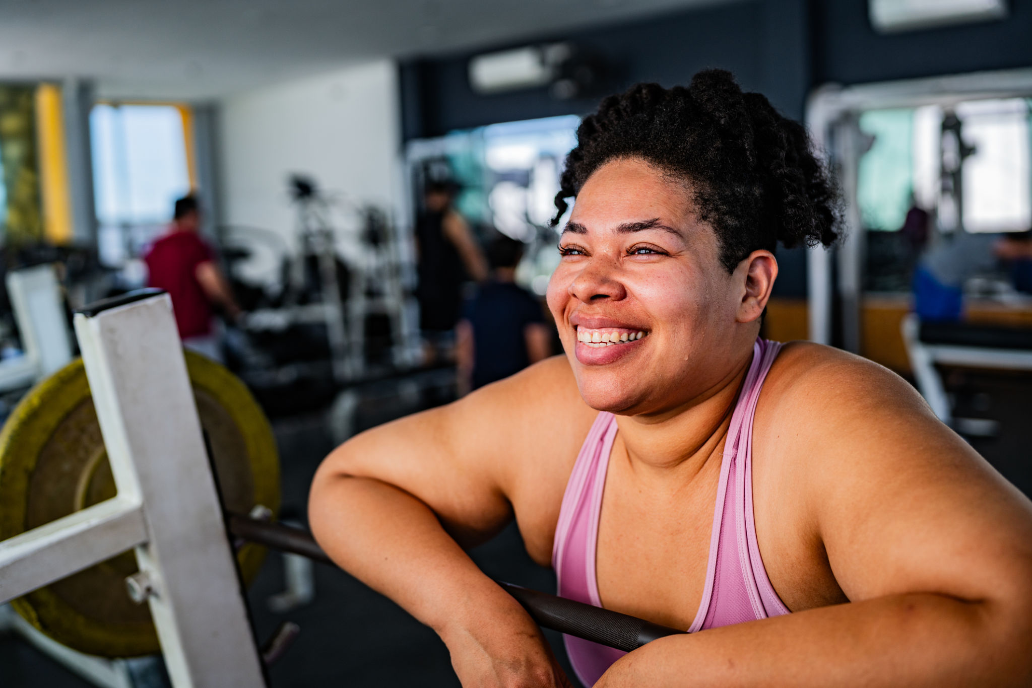 Mid adult woman contemplating at gym Mid adult woman contemplating at gym