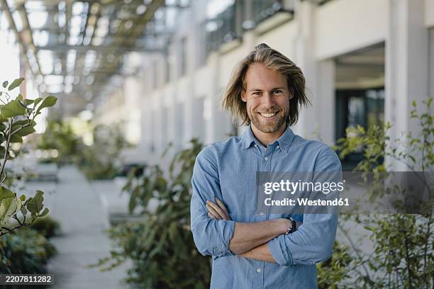 portrait of a smiling young man in the city - north brabant stock pictures, royalty-free photos & images