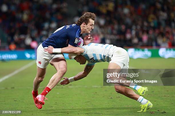 Stephen Parez Edo Martin of France is challenged by Argentina during the men's cup final match between Argentina and France in the HSBC Hong Kong...