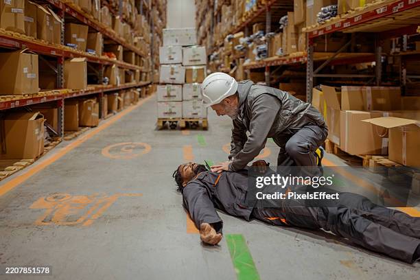 first response: supervisor aids collapsed colleague - fainting stock pictures, royalty-free photos & images