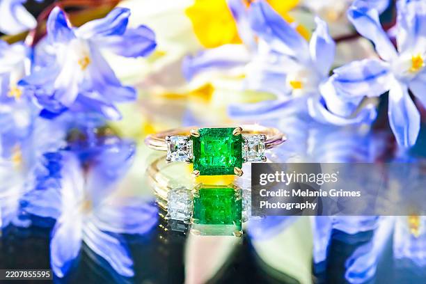 emerald and diamond ring with spring flowers - emerald green stock pictures, royalty-free photos & images