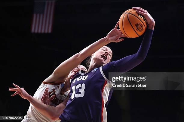 Sedona Prince of the TCU Horned Frogs and Taylor Jones of the Texas Longhorns battle for the ball during the first half in the Elite Eight round of...