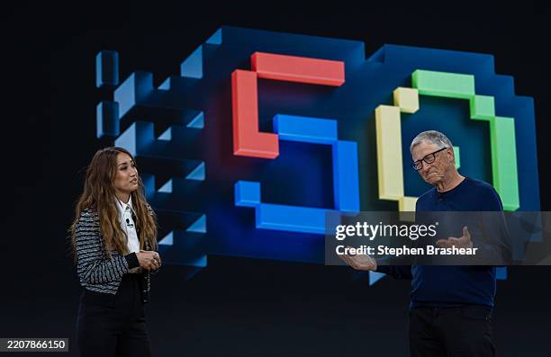 Former Microsoft CEO Bill Gates, right, chats with actor Brenda Song during an event celebrating the 50th Anniversary of the Microsoft April 4, 2025...