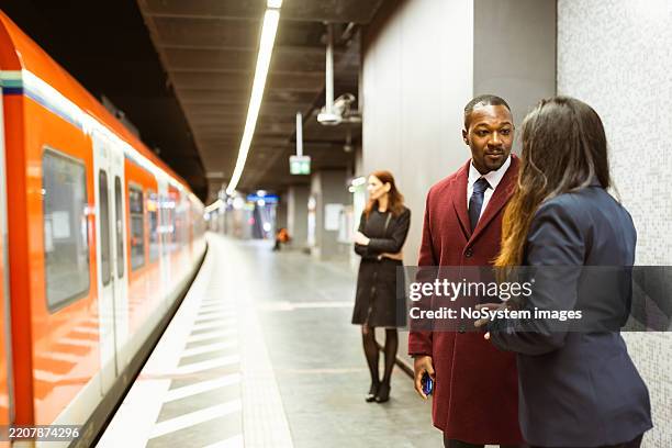 rush hour train station interaction - pedestrian tunnel stock pictures, royalty-free photos & images