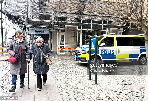 two women walking on malmö shopping street, one using a cane, - pedestrian stock pictures, royalty-free photos & images