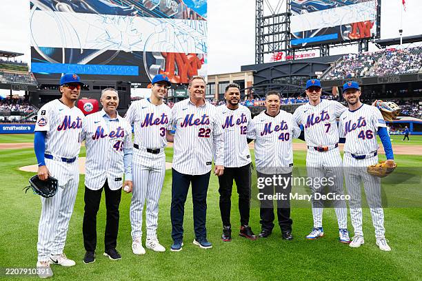 John Franco, Al Leiter, Juan Lagares and Bartolo Colón pose for a photo after throwing out the ceremonial first pitch prior to the game between the...
