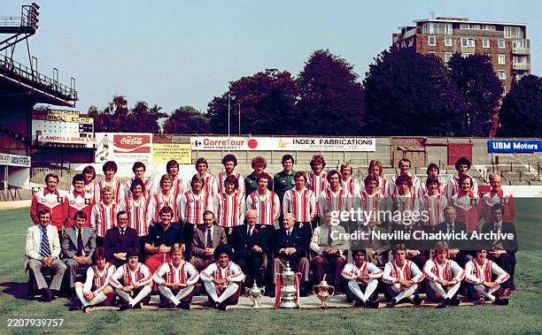 Southampton line up for a team photograph alongside the FA Cup trophy at The Dell in Southampton during the pre-season photo-call, circa August 1976....
