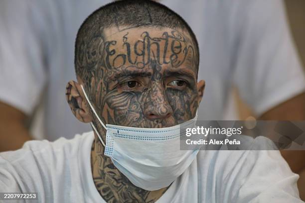 Prisoner looks out of his cell at maximum security penitentiary CECOT on April 4, 2025 in Tecoluca, San Vicente, El Salvador. Amid internal legal...