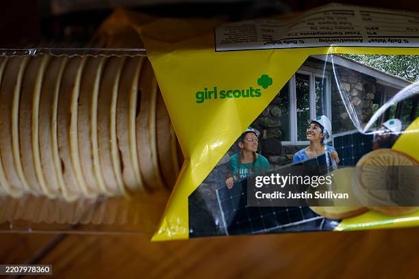 In this photo illustration, a package of Girl Scout cookies is displayed on April 01, 2025 in San Anselmo, California. A class-action lawsuit has...