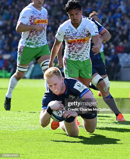 Jamie Osborne of Leinster scores his sides third try during the Investec Champions Cup Round of 16 match between Leinster Rugby and Harlequins at...