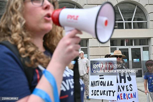 Demonstrators gather outside USAID offices for the nationwide "Hands Off!" protest against US President Donald Trump and his advisor, Tesla CEO Elon...