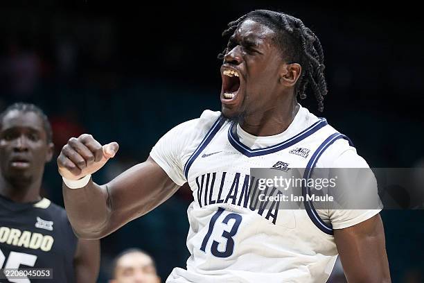 Enoch Boakye of the Villanova Wildcats reacts after a dunk in the second half of a first round game of the College Basketball Crown tournament...