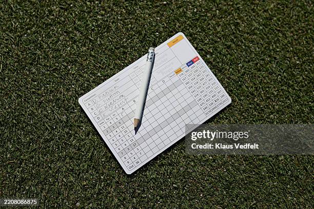 golf score card with pencil on grass - score card stock pictures, royalty-free photos & images