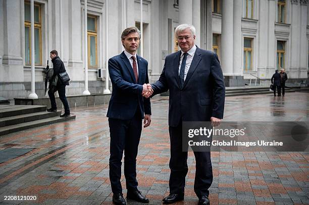 Minister Of Foreign Affairs Of Lithuania Kestutis Budrys and Minister of Foreign Affairs of Ukraine Andrii Sybiha shake hands near building of the...