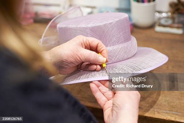 a milliner working on a hat - hat maker stock pictures, royalty-free photos & images