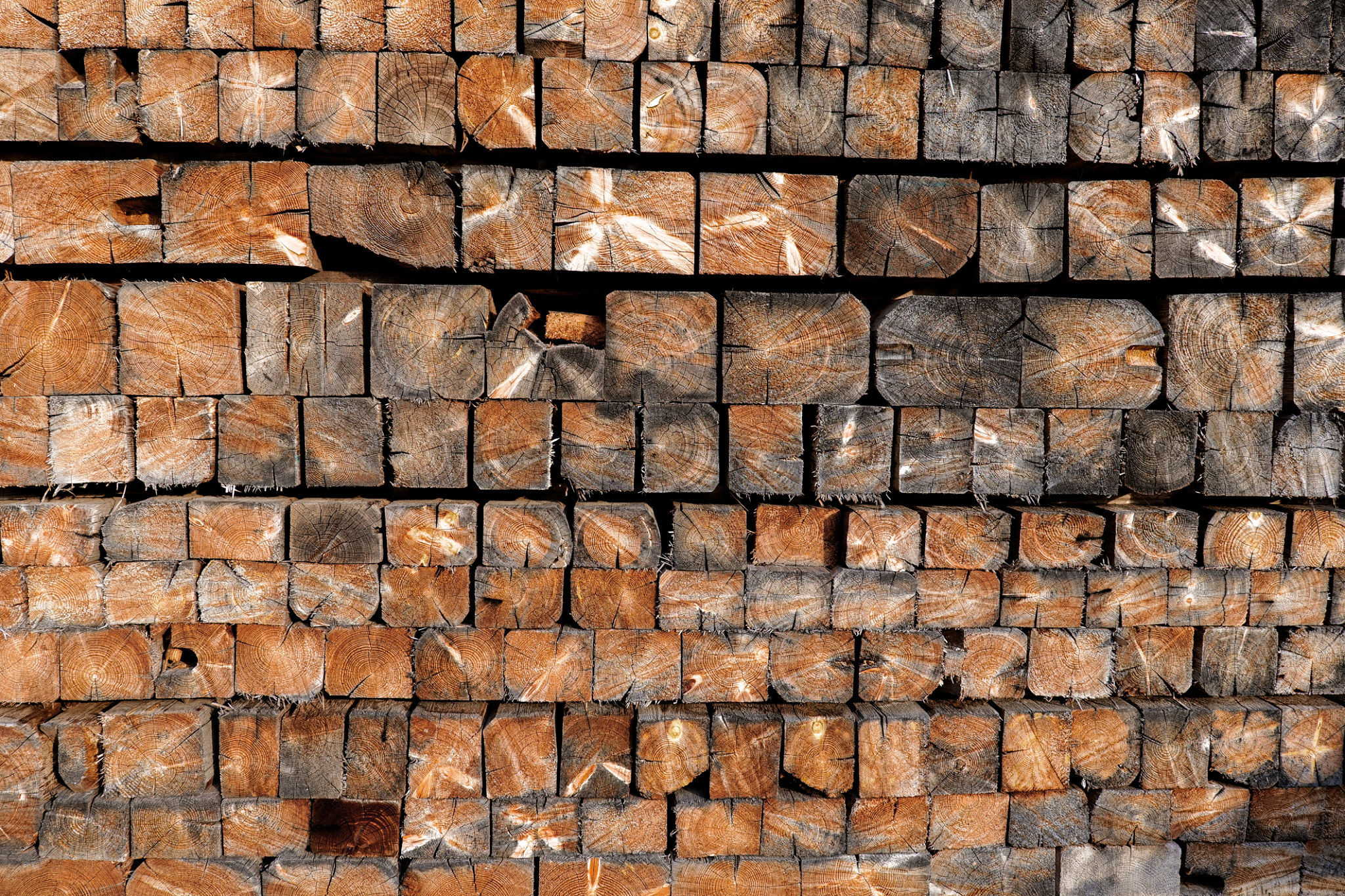 Stacked Wooden Beams with Natural Texture. Rustic vintage background. Square wooden bars wallpaper. Stacked Wooden Beams with Natural Texture. Rustic vintage background. Square wooden bars wallpaper.