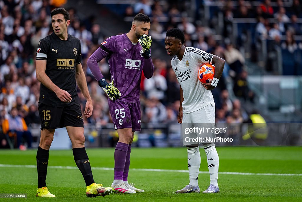 Labib Cf Giorgi Mamardashvili of Valencia CF speaks with Vinicius Junior of ...