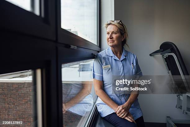 taking a break from nursing - nurse stock pictures, royalty-free photos & images