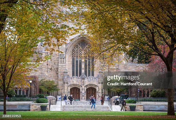 Students walk in front of the Sterling Memorial Library at Yale University on Nov. 1 in New Haven, Connecticut. A Yale police officer has been...
