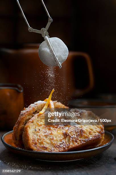 torrijas de semana santa - traditional homemade spanish dessert with orange sirup in easter - french toast stock-fotos und bilder