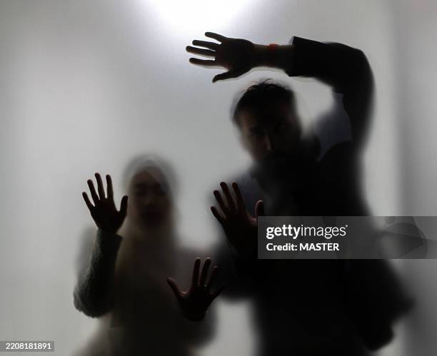bride and groom dark silhouettes - muslim wedding dress stock pictures, royalty-free photos & images