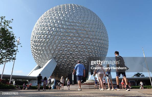 April Epcot People enter the grounds of Epcot at Walt Disney World on April 1 in ...