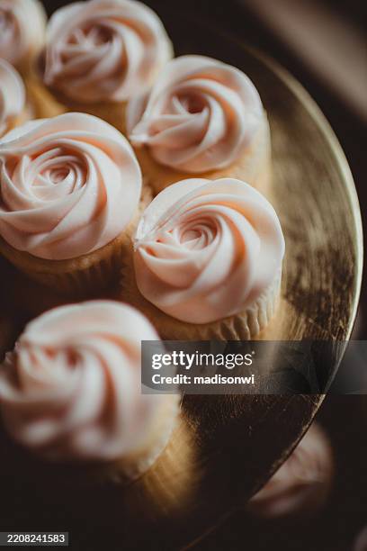 light pink cupcakes with frosting - dessert stand stock pictures, royalty-free photos & images
