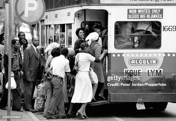 Black and white segregation on buses in Johannesburg during the apartheid years, circa 1976.