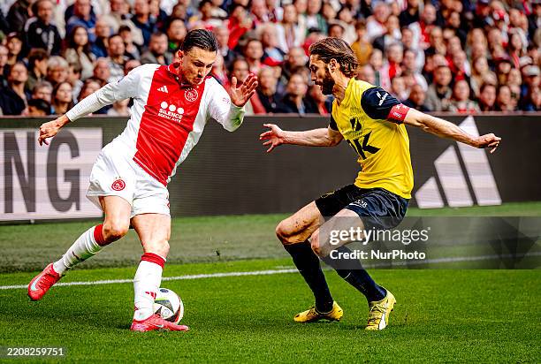 Ajax Amsterdam forward Steven Berghuis and NAC Breda defender Jan van den Berg play during the match between Ajax and NAC at the Johan Cruijff ArenA...