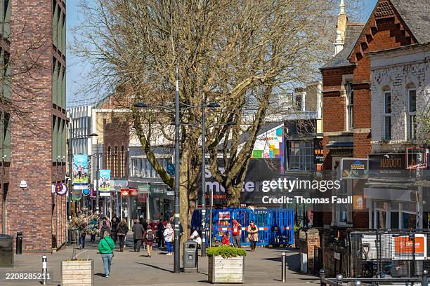 people walking among swindon city centre shops - swindon stock pictures, royalty-free photos & images