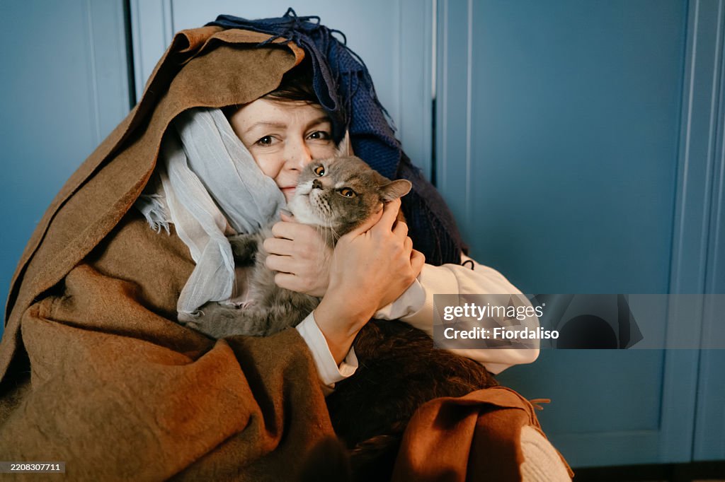 Portrait of a happy woman with domestic cat