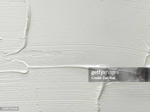 close up white paint on wall surface with brush marks - thick stock pictures, royalty-free photos & images