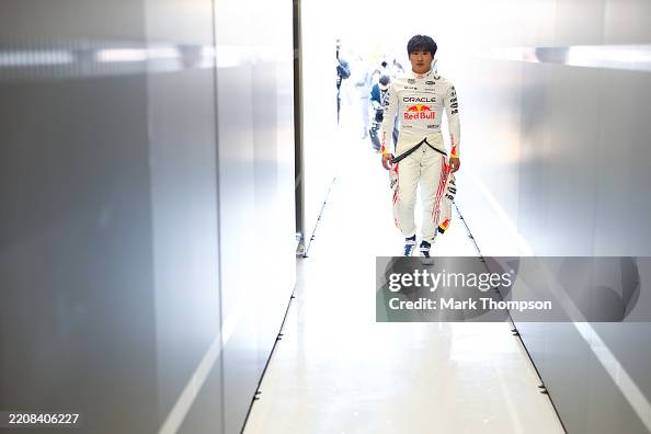 Oracle Red Bull Racing Japan Yuki Tsunoda of Japan and Oracle Red Bull Racing enters the garage ...