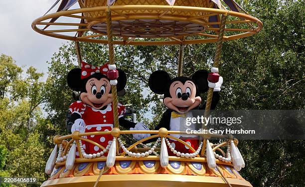 The Mickey Mouse and Minnie Mouse float passes by during the daily Festival of Fantasy Parade at the Magic Kingdom Park at Walt Disney World on April...