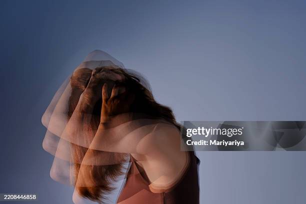 a concept photo illustrating migraines and head pain. - fobia imagens e fotografias de stock