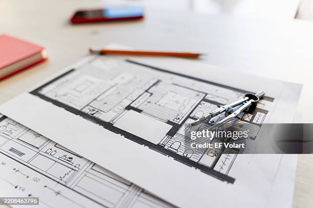 architect designing a new apartment using pencil and compass - engineer drawing stock pictures, royalty-free photos & images
