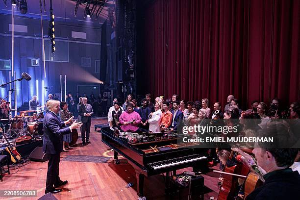 King Willem-Alexander of the Netherlands meets musicians in the Amphion Theater in Doetinchem where the annual Koningsdagconcert took place on April...