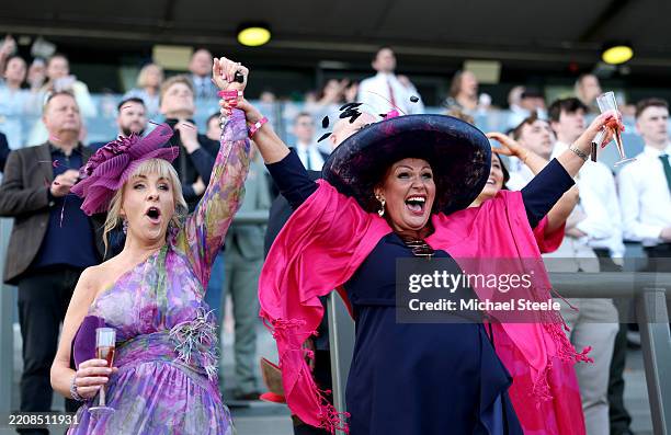 Racegoers react as they watch the action from the Hallgarten And Novum Wines Handicap Hurdle during Ladies Day at Aintree Racecourse on April 04,...