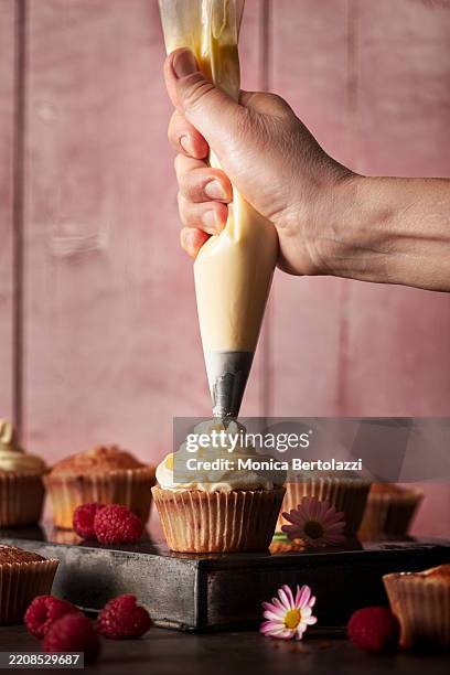 raspberry cupcakes preparation - lemon raspberry muffin stock pictures, royalty-free photos & images