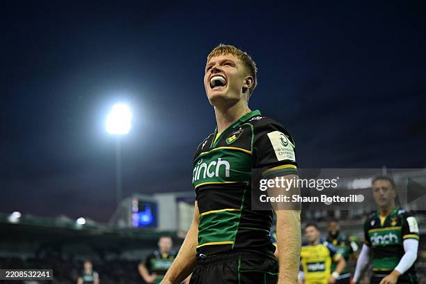 Fin Smith of Northampton Saints celebrates after scoring a try during the Investec Champions Cup Round of 16 match between Northampton Saints and ASM...