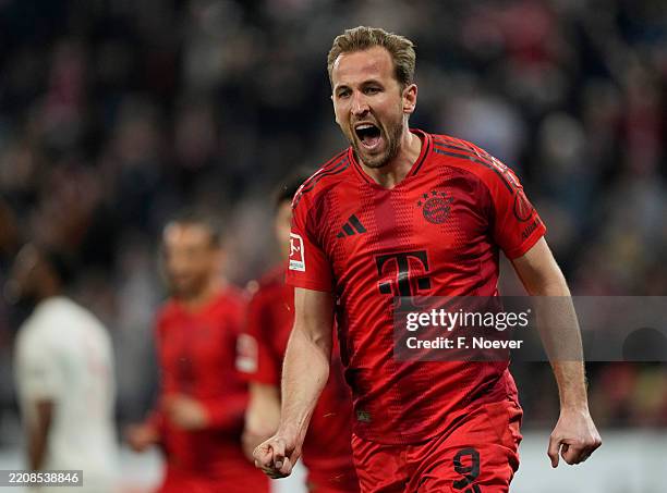 Harry Kane of Bayern Munich celebrates scoring his team's second goal during the Bundesliga match between FC Augsburg and FC Bayern München at...