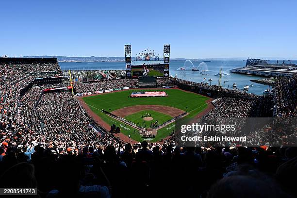 General view of the ballpark during the National Anthem before the San Francisco Giants play the Seattle Mariners during the home opener at Oracle...