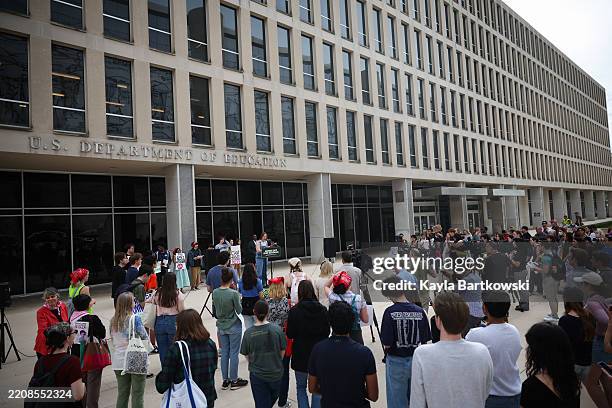 Student protestors hold signs while participating in the "Hands Off Our Schools" rally in front of the U.S. Department of Education on April 04, 2025...